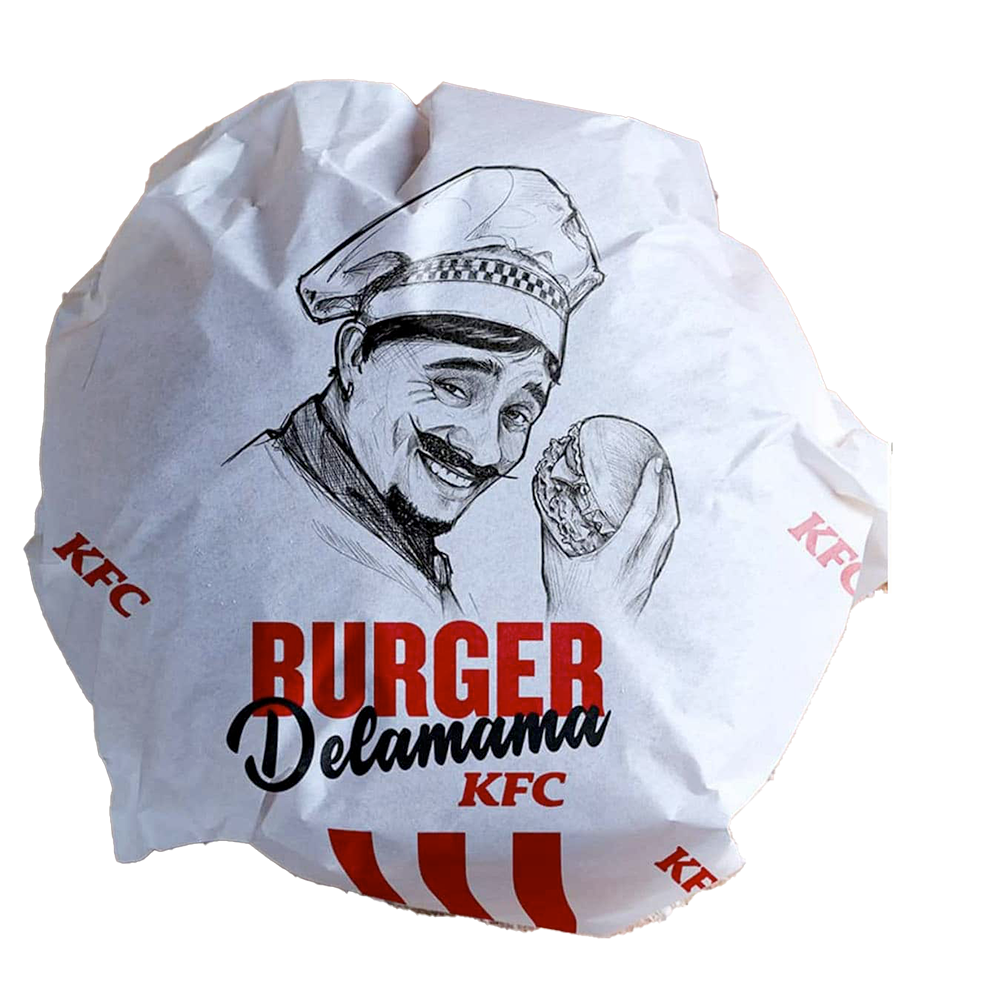 Un burger Delamama dans son emballage en papier.